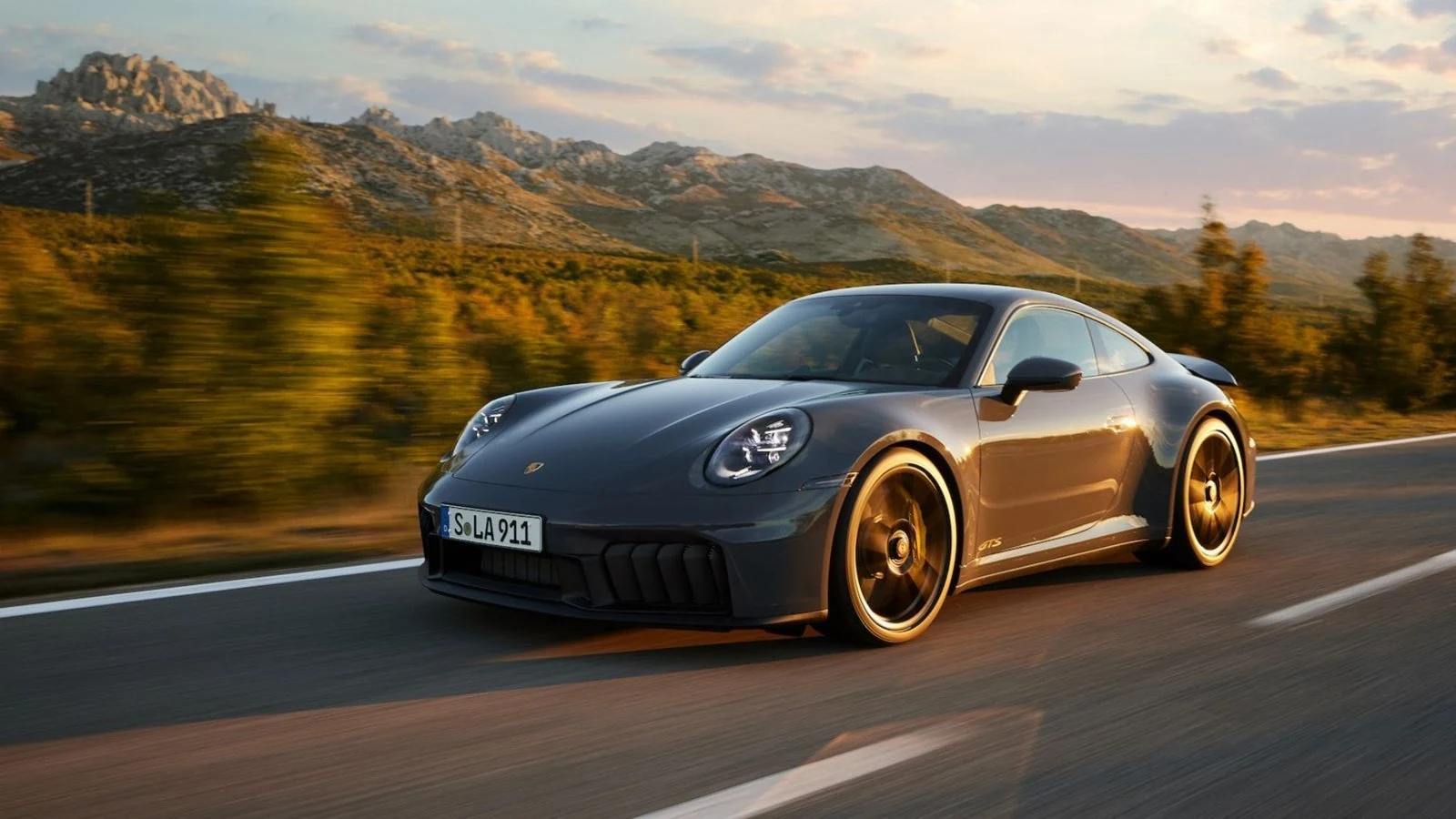 Porsche on a winding mountain road
